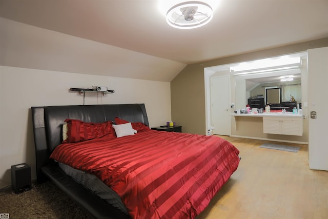 bedroom with wood-type flooring and lofted ceiling