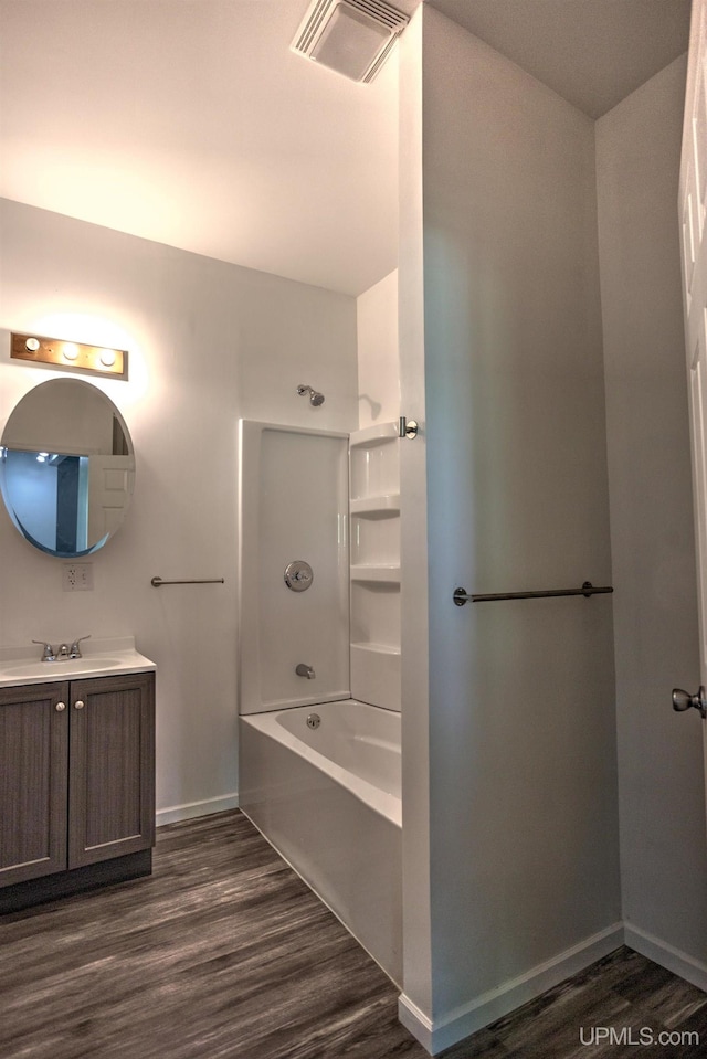 bathroom with hardwood / wood-style floors and vanity