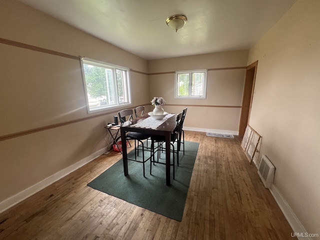 dining area featuring dark hardwood / wood-style flooring