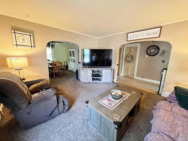 carpeted living room with ornamental molding