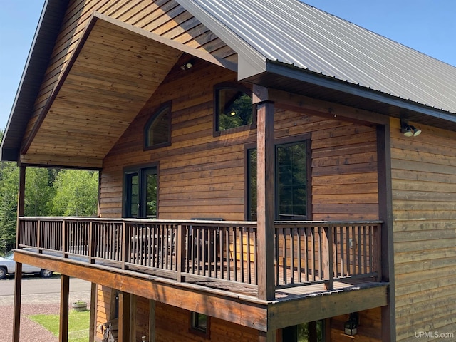 view of side of home featuring metal roof