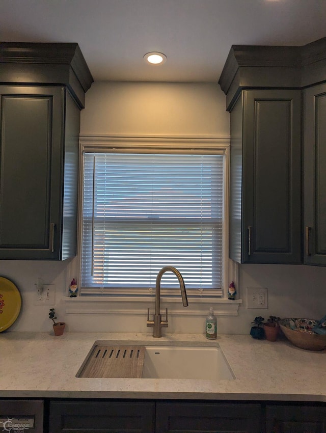 kitchen with dishwashing machine, a wealth of natural light, and sink