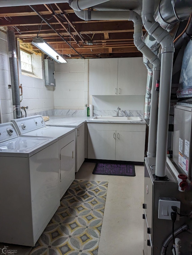 laundry area with washer and clothes dryer, sink, and electric panel