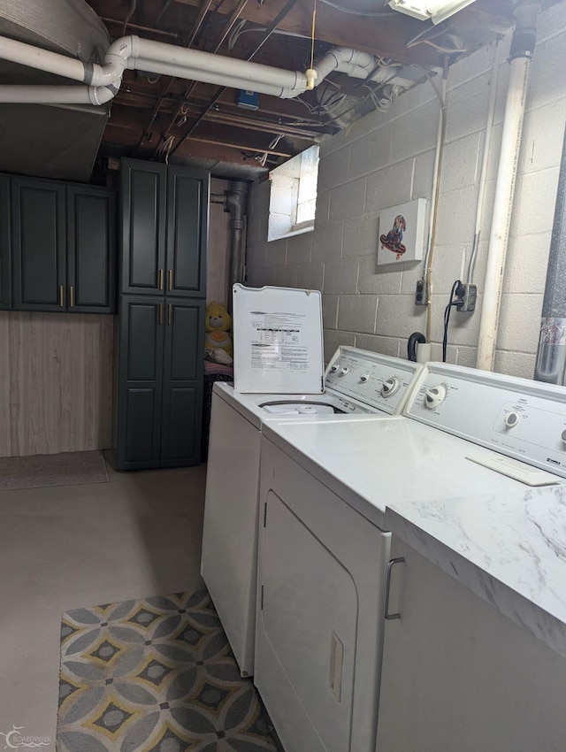 laundry area with cabinets and separate washer and dryer