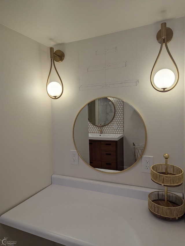 room details featuring decorative backsplash and sink