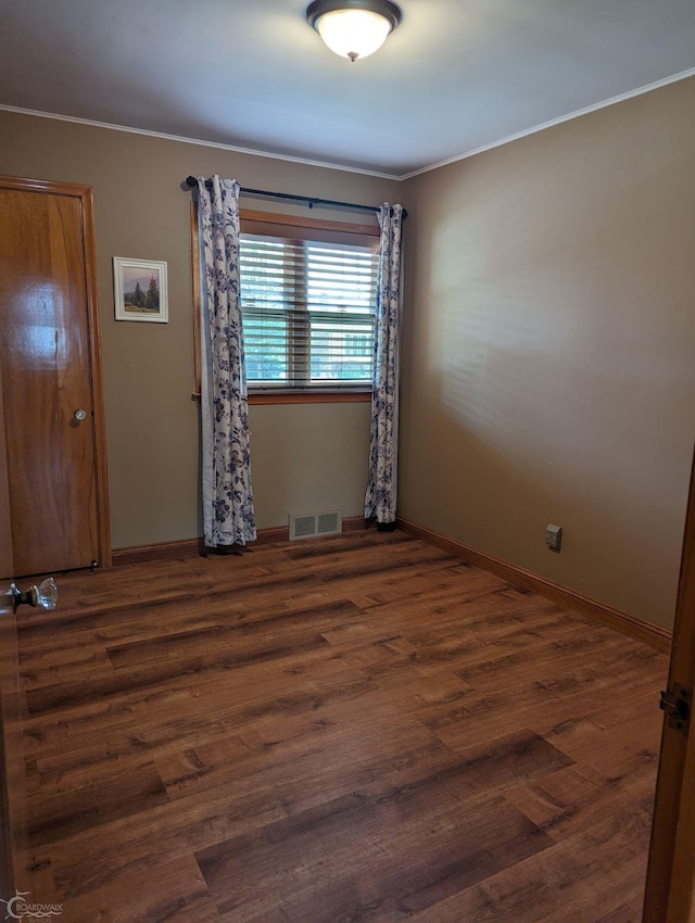 unfurnished room with dark hardwood / wood-style floors