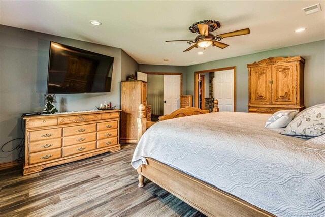 bedroom featuring hardwood / wood-style flooring and ceiling fan