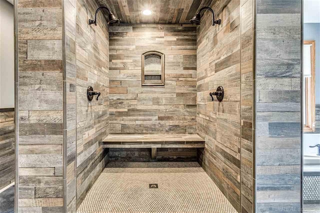 bathroom featuring wood ceiling and a tile shower