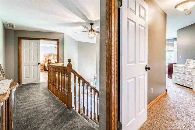 hall featuring carpet floors