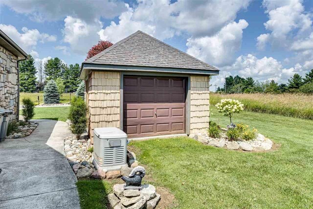 garage featuring a yard