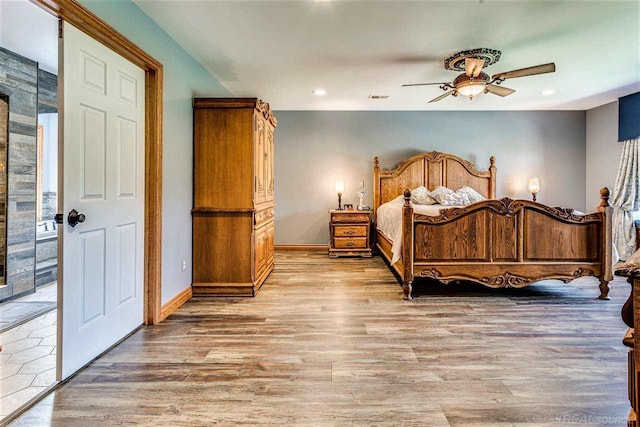 bedroom with ceiling fan and hardwood / wood-style floors