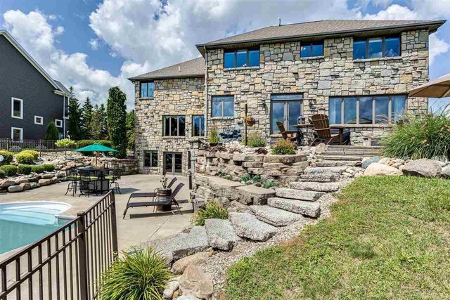 rear view of house with a patio