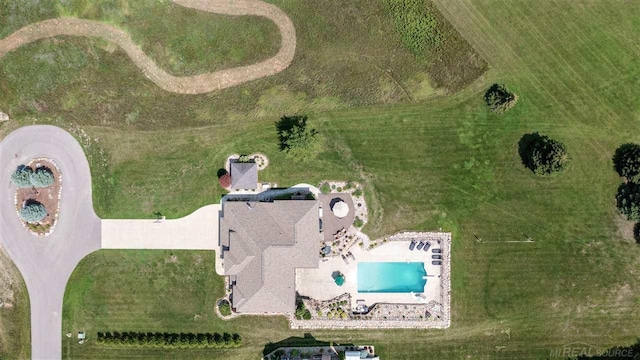 birds eye view of property with a rural view