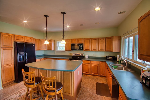 kitchen with a center island, sink, hanging light fixtures, and black appliances