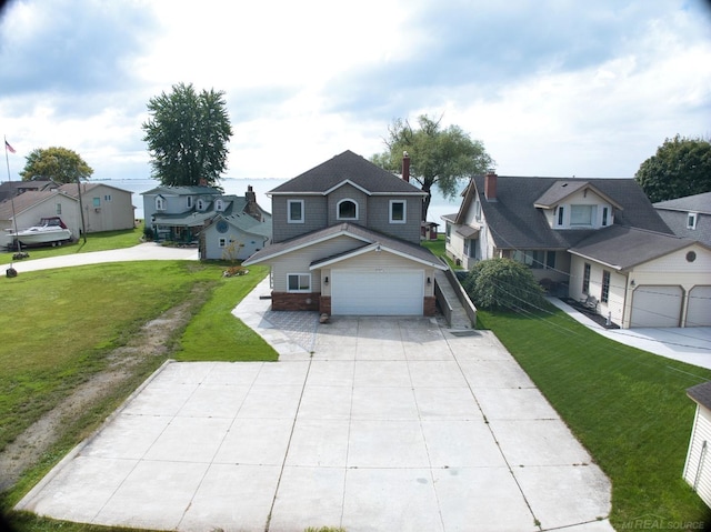 view of front facade with a garage and a front lawn