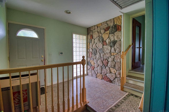 foyer with tile patterned floors