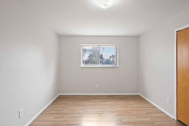 unfurnished room featuring light hardwood / wood-style floors