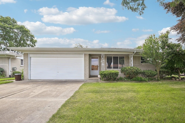 ranch-style house featuring a garage and a front yard