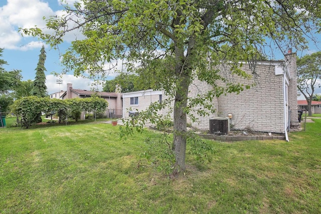 view of yard featuring central AC