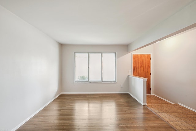 spare room featuring hardwood / wood-style flooring