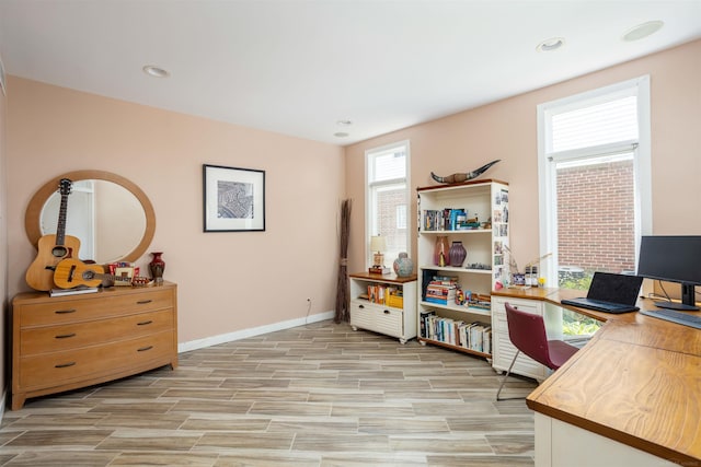 office space featuring wood tiled floor, baseboards, and recessed lighting