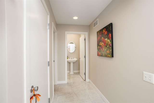 hallway with light tile patterned flooring