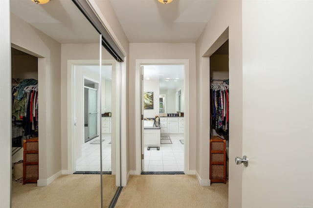 hall with light tile patterned flooring