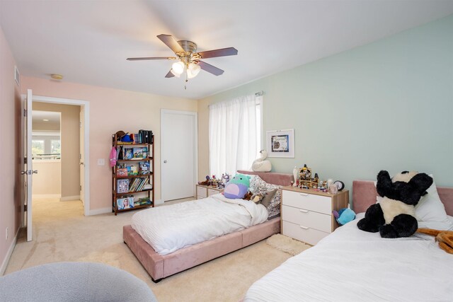 carpeted bedroom featuring ceiling fan