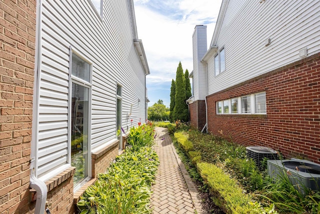 view of property exterior with central AC