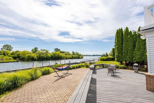 wooden deck with a water view