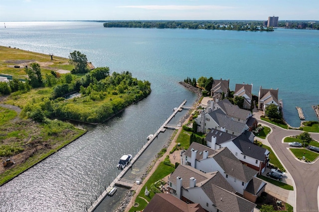 drone / aerial view featuring a residential view and a water view