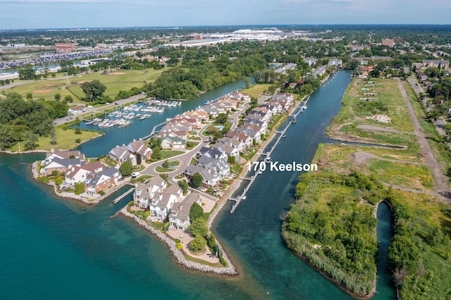 bird's eye view featuring a water view and a residential view