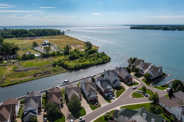 birds eye view of property with a water view and a residential view