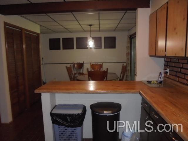 kitchen featuring butcher block counters and hanging light fixtures