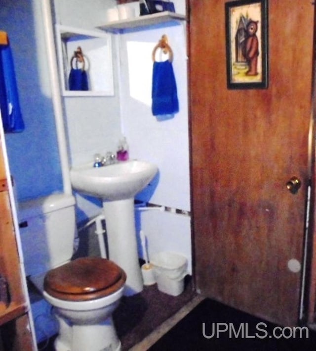 bathroom featuring toilet