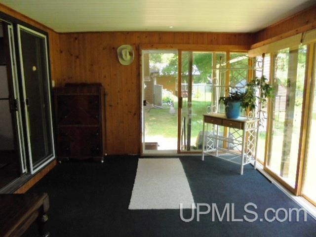 unfurnished sunroom featuring a healthy amount of sunlight