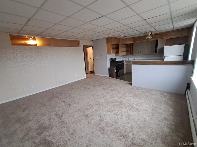 kitchen with electric range oven, a baseboard heating unit, white refrigerator, a drop ceiling, and dark carpet