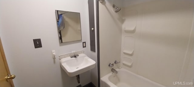 bathroom with shower / tub combination and sink