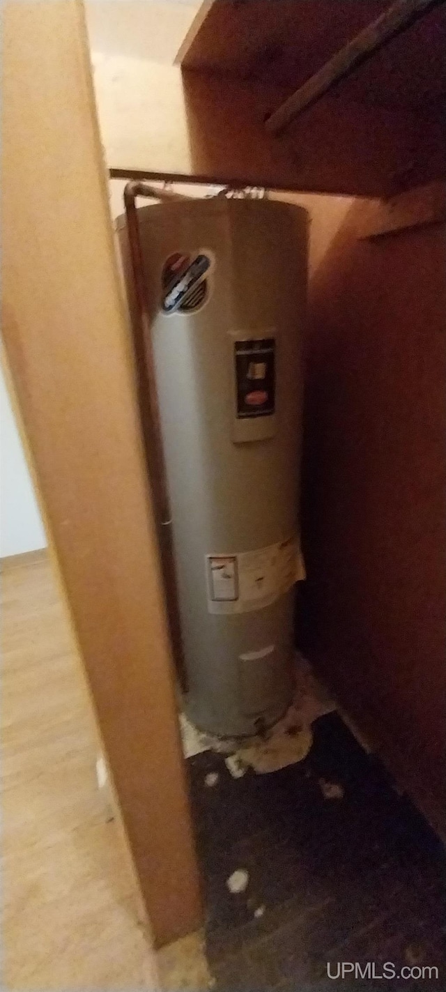 utility room featuring water heater