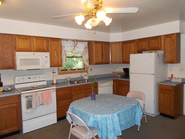 kitchen featuring ceiling fan, sink, and white appliances