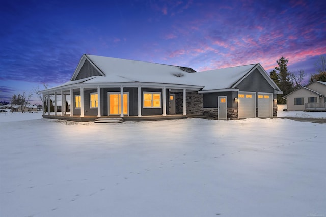 view of front of home with a garage and covered porch