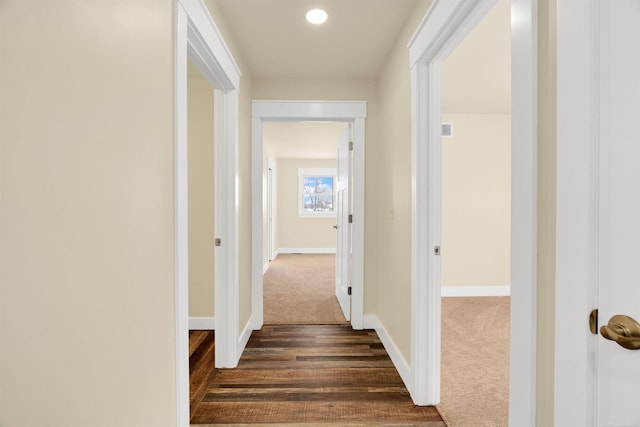 corridor with dark carpet