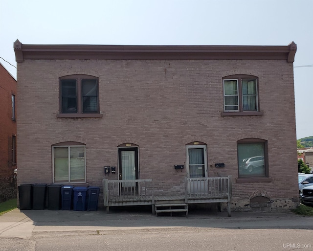 view of front of home featuring brick siding