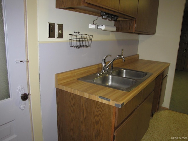 kitchen with wood counters and a sink