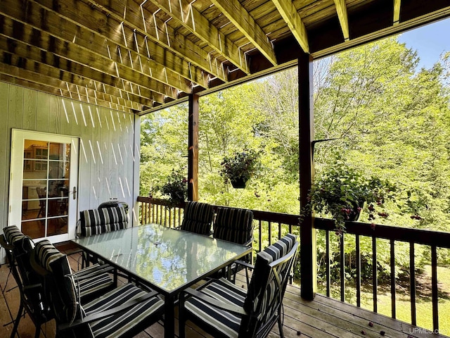 wooden terrace with outdoor dining space