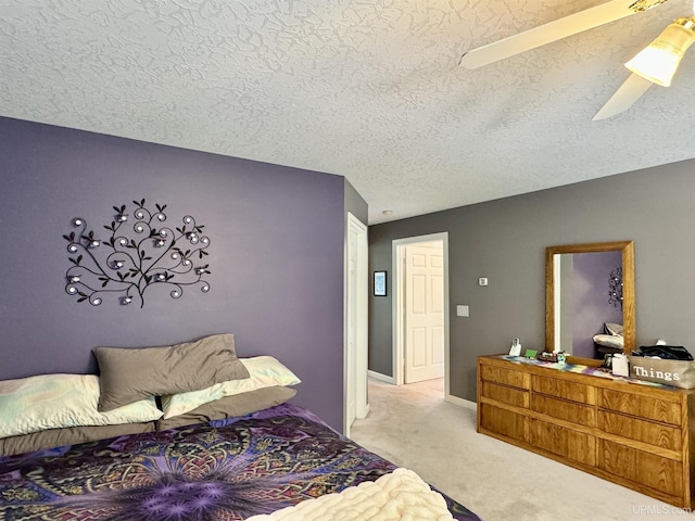 carpeted bedroom with baseboards and a textured ceiling