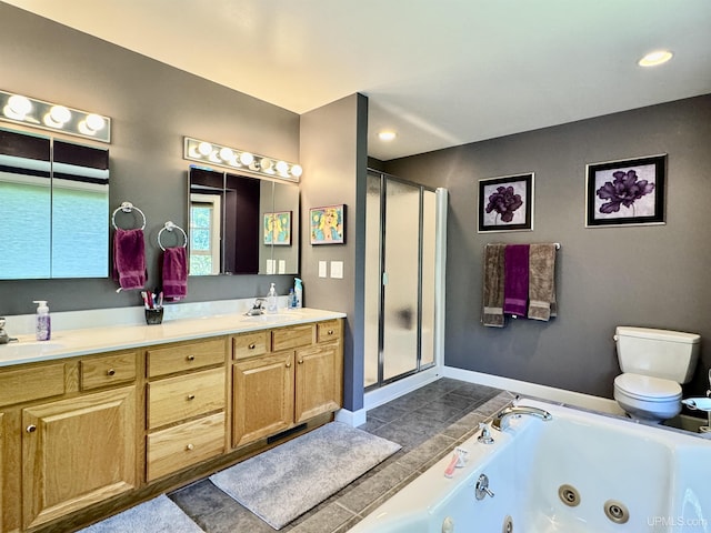 bathroom with a shower stall, a jetted tub, toilet, double vanity, and a sink