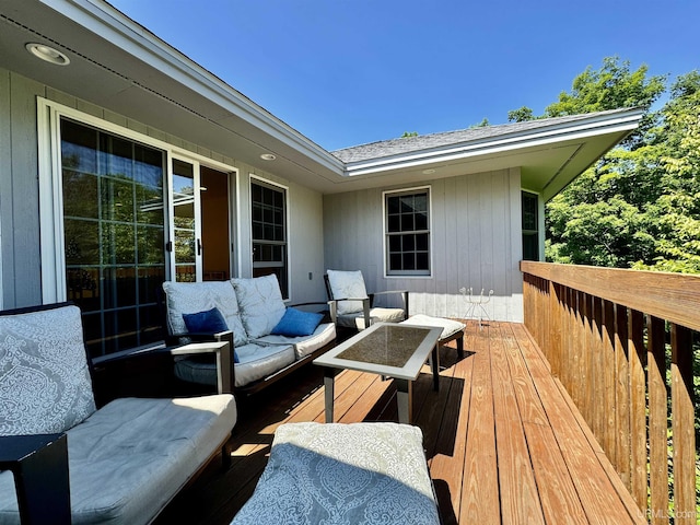 wooden terrace featuring outdoor lounge area