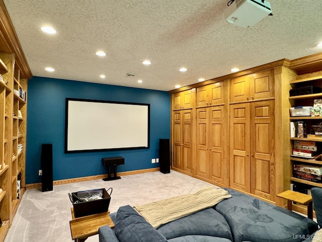 home theater featuring recessed lighting, baseboards, light carpet, and a textured ceiling