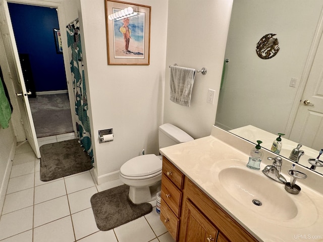 full bathroom with tile patterned flooring, toilet, vanity, and baseboards